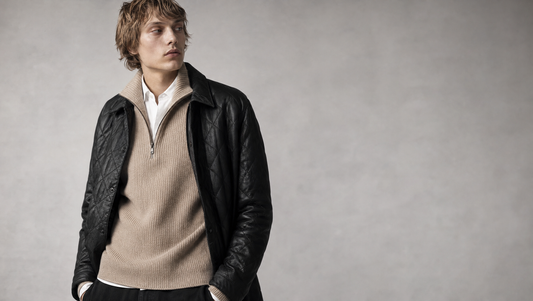 Quilted faux leather jacket over a beige half-zip knit and collared shirt